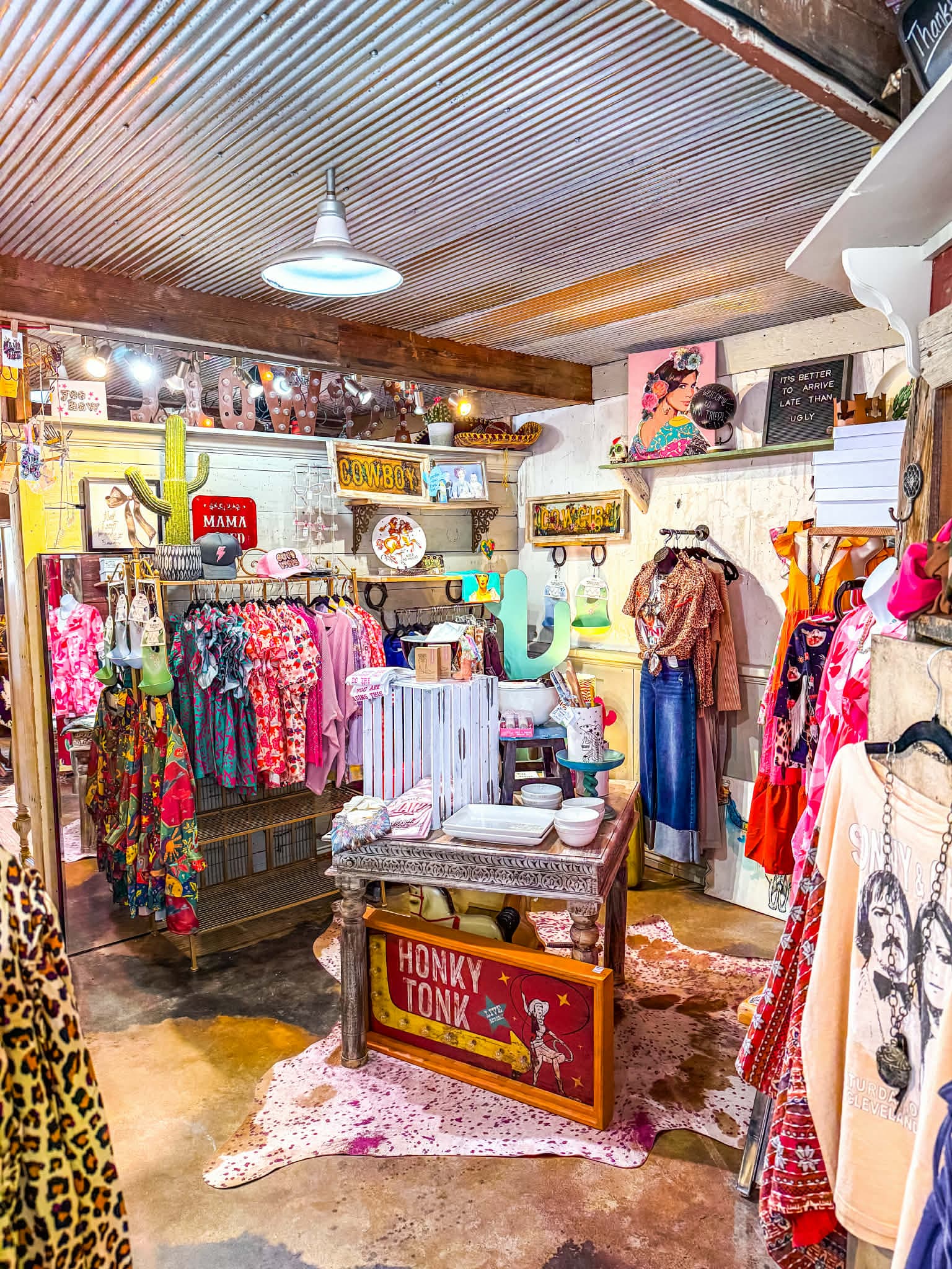 Inside Mama Tried Boutique — racks of western-inspired fashion and rustic decor